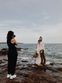 Portrait of Ivy Christina, destination wedding and elopement photographer based in Minneapolis, Minnesota taking couples photos