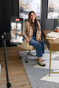 business professional in a suit top getting professional headshot