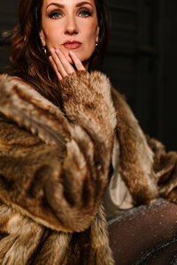 Photo of Juliet Trnka in a fur coat, close-up portrait