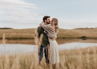 Engaged man lifting up his fiancee