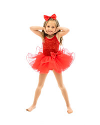 little girl wearing dance costume while smiling