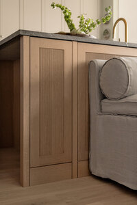 Close up of reeded white oak kitchen cabinet