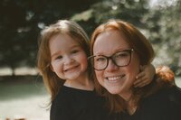 Grandparents holding grandson on lap outside
