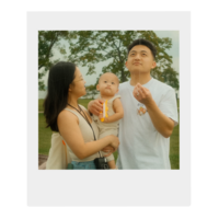 Polaroid photo of Cindy's family flying a kite.