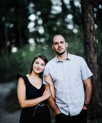 couple-standing-together-in-forest-clearing