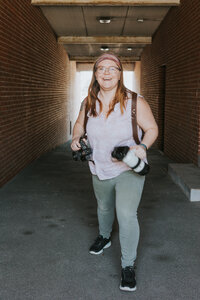 erin gage photography with her cameras being silly