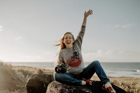 Girl with camera adventurous mountaintop photographer