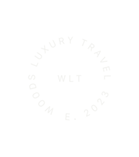 Text based circular logo with words "Woods Luxury Travel"