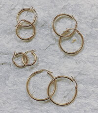 yellow gold hoop earrings of various sizes