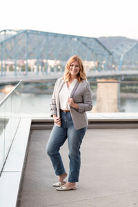 woman smiling with chattanooga walking bridge in the background