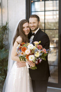 Dream Weddings WI, wedding planner Wisconsin, couple embracing for a photo at their Wisconsin Wedding.