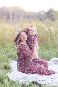 Family lifestyle photo session in natural outdoor field in Huntersville NC