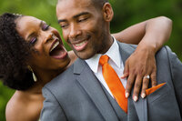 Bride laughing while looking closely at her groom, sharing a fun and intimate wedding moment.