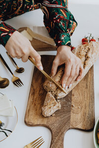 Nutritionist cutting bread