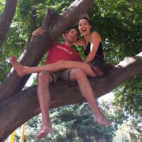 Couple sitting in tree