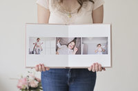 Jess Morgan holding open family photo album