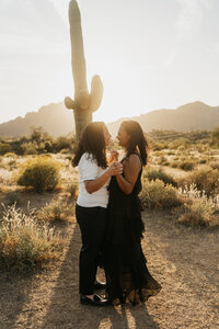 A couple dancing together in the desert 