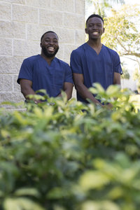 two male nursing students smiling