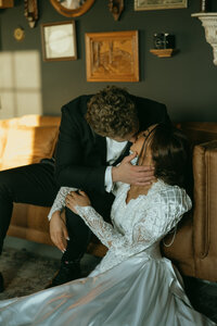 Couple shares a kiss as he gently holds her face