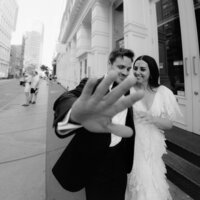 editorial paparazzi style photo of groom and bride in Manhattan NYC