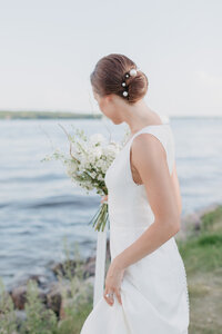 Minneapolis bride gazing at the shoreline