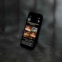A smartphone displaying the mobile-optimised website for Patty Freaks, showcasing their collaboration with The Railway Stourbridge. The screen features images of gourmet burgers, a header titled "The Railway Stourbridge X Patty Freaks!" and information about their new joint.
