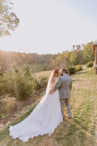 Sunset kiss at North Georgia farm wedding venue