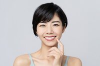 A woman smiling with white teeth
