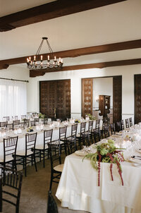 Wedding reception details of elegant long tables.