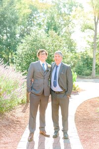 Tommy and his Dad smile for the camera on his wedding day.