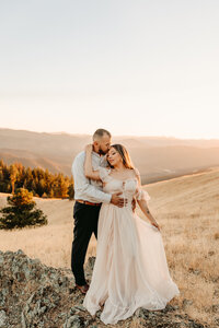 Couple Embracing on the Hill | Photography by Jocelyn