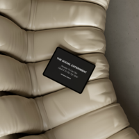 an ipad on a couch with a mockup for The Social Experiment