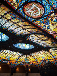 A ceiling filled with intricate detailed stained glass