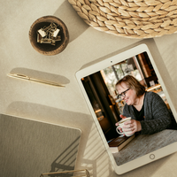 Lifestyle flat lay with coffee cup, journal, and printed photos symbolizing a free self-love and boundaries workbook