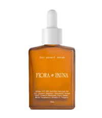 A square-shaped amber glass bottle of Flora x Fauna's Bio Accent Serum, featuring a dropper cap. The label showcases the brand’s name in elegant typography, with details about the serum's natural and organic ingredients, including certified plant-based oils. The clean, minimalist design emphasizes the product's eco-friendly and high-quality formulation.