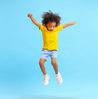 kid jumping in air with confetti blue bakcground
