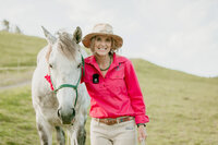 courtney brown with white and grey horse