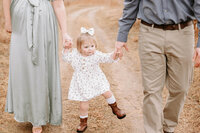 Toddler wearing boots walking at Cibolo Nature Park