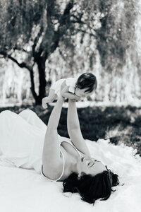 black and white photo of mom and newborn daughter