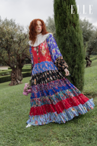 red-haired model in colorful gown for ELLE Fashion editorial in park  