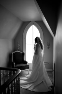 black and white photo of bride getting ready