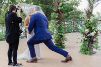 groom kisses brides hand