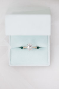 Diamond engagement ring in something blue box photographed by top wedding photographer Rebecca Cerasani