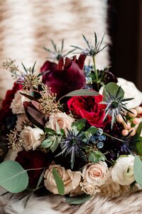 red, navy and ivory bridal bouquet with greenery