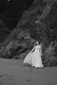 black and white image bride on beach