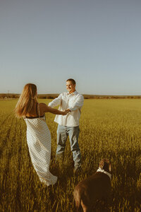 Dreamy golden hour couples session in a field in Ovalo, TX