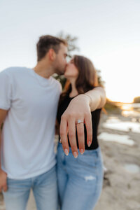 Alt Text:
Michigan engagement photographer capturing relaxed, candid beach proposal moments for playful and authentic couples in love.
