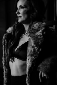 A black and white side profile photo of Juliet Trnka - coyote shaman, forbes business council member, published author, mama, self-made millionaire
