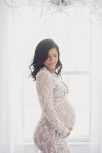 Beautiful pregnant woman in lace dress