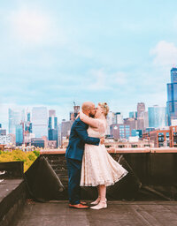 First kiss on rooftop deck in Chicago, West Loop